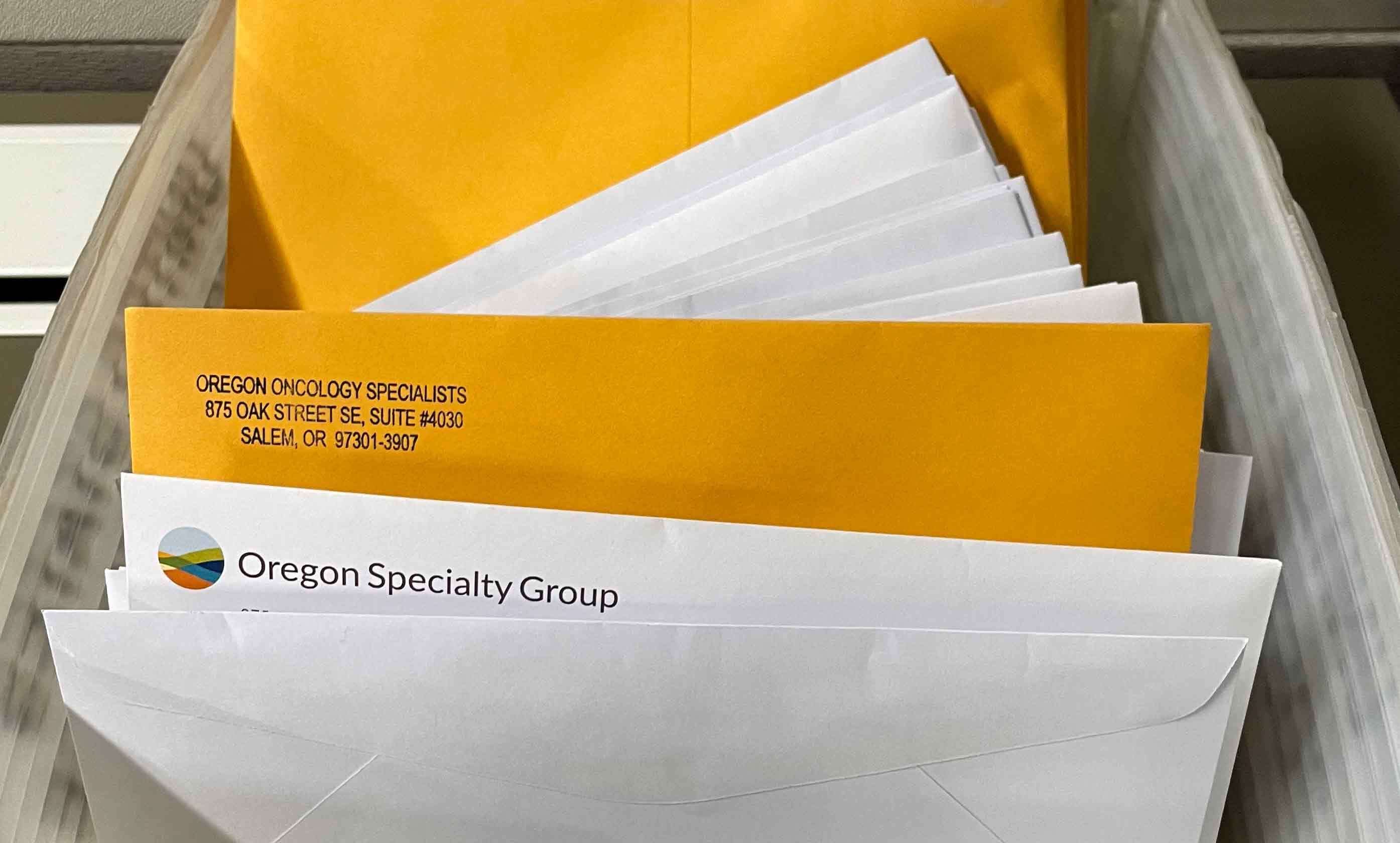 A stack of paper medical claims piling up in the Salem, Ore., business office of Oregon Specialty Group. The cancer care provider had to revert to paper billing following a cyberattack that disrupted billions in payments nationwide.