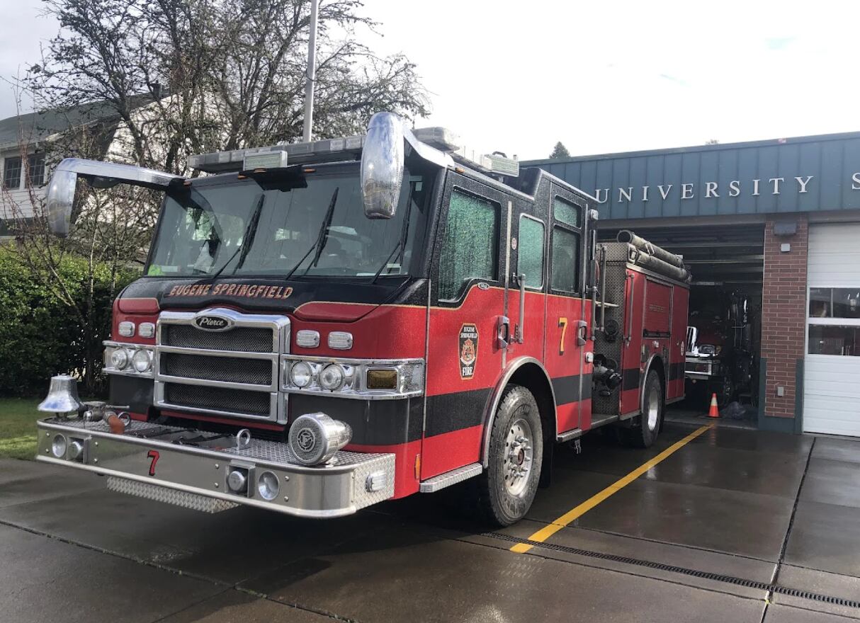 An undated photo of a fire engine parked in front of University Station in Eugene.