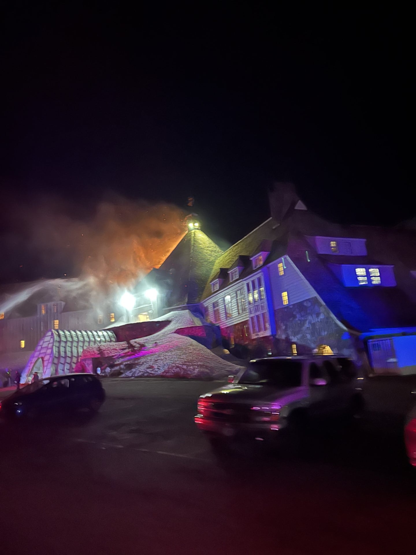 Crews attempt to extinguish a fire in the attic of Timberline Lodge on Mount Hood in Oregon, Thursday, April 18, 2024, in this photo provided by Clackamas Fire District. The fire was extinguished early Friday morning and no injuries were reported.