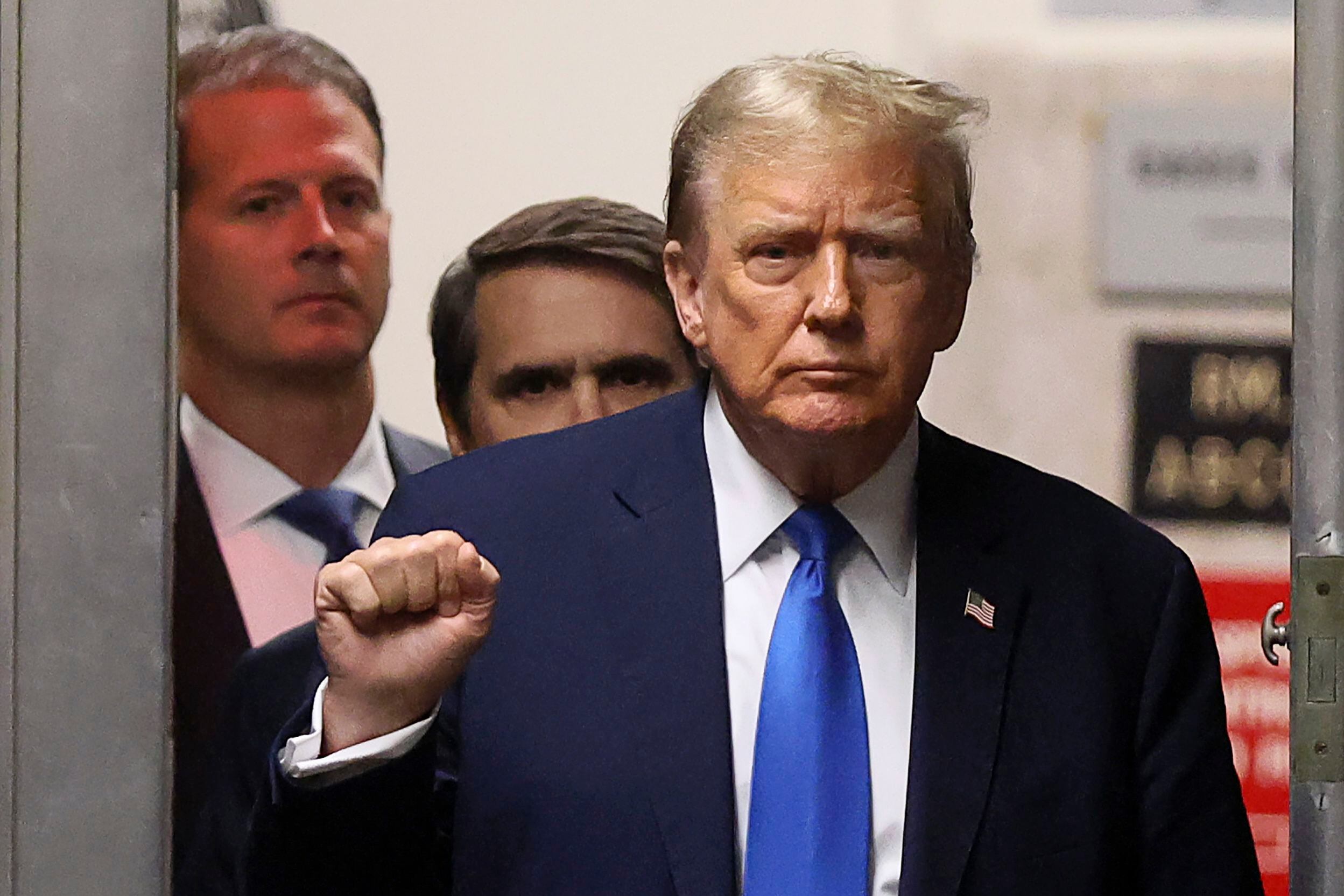 Former President Donald Trump gestures as he returns to the courtroom during a recess in his criminal trial at Manhattan Criminal Court on Thursday.