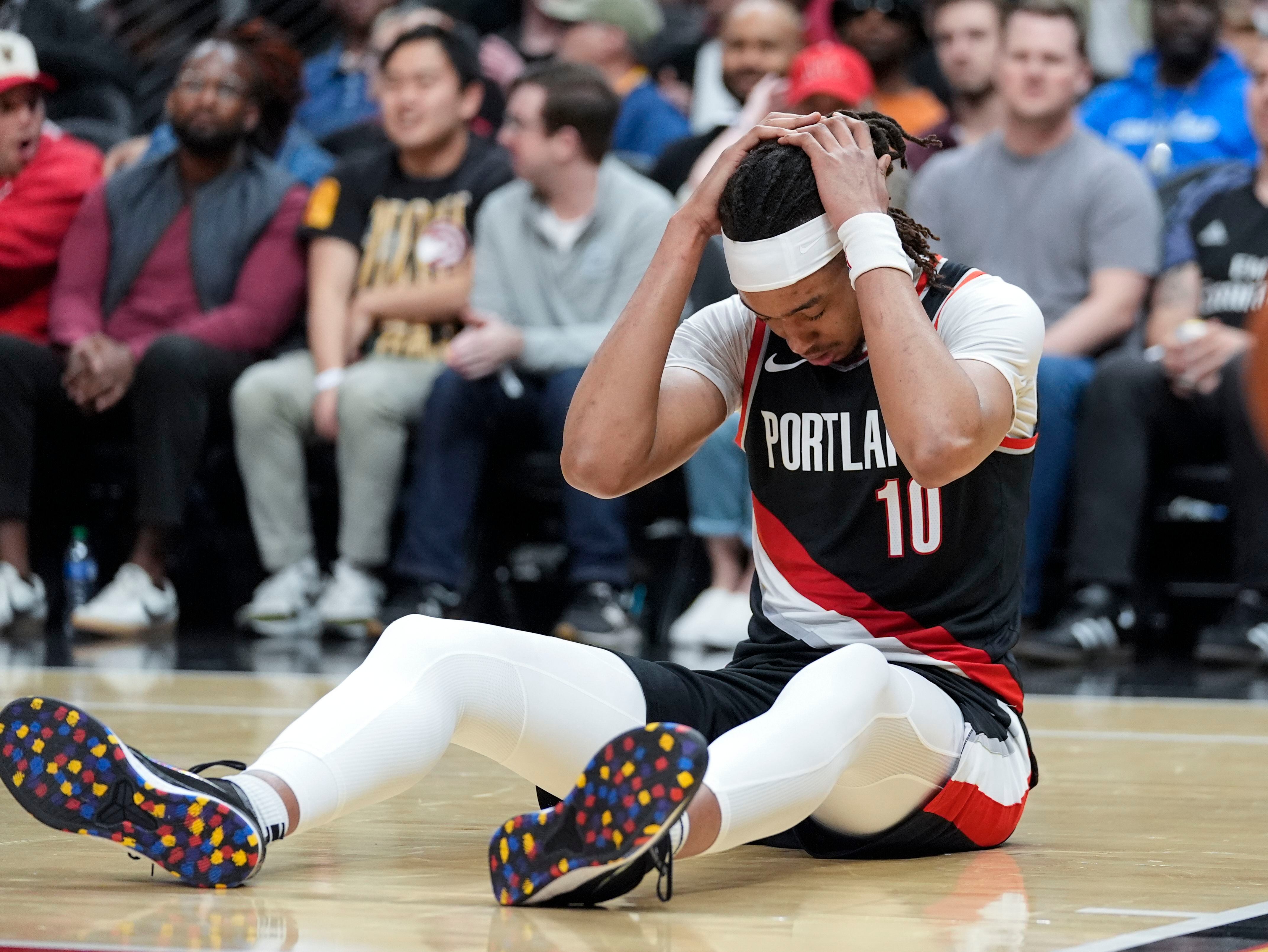 Portland Trail Blazers center Moses Brown (10) reacts after being fouled during the second half of an NBA basketball game against the Atlanta Hawks Wednesday, March 27, 2024, in Atlanta.