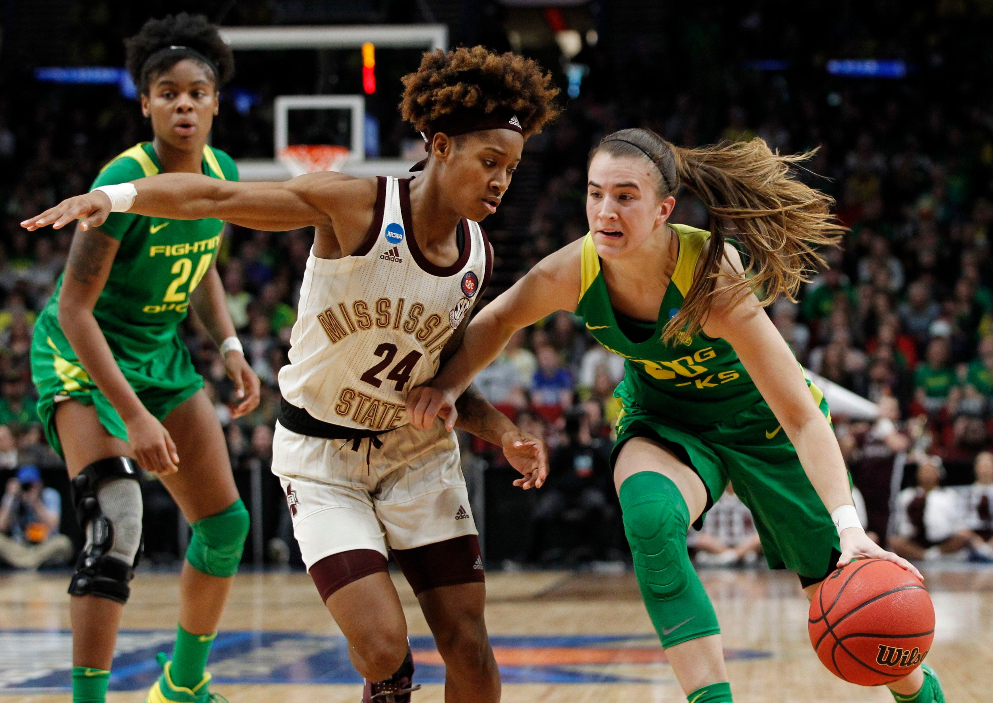 FILE: Oregon guard Sabrina Ionescu, right, drives to the basket against Mississippi State guard Jordan Danberry, left, during the second half of a regional final in the NCAA women's college basketball tournament on March 31, 2019, in Portland, Ore. Portland is once again hosting women's tournament games in 2024.