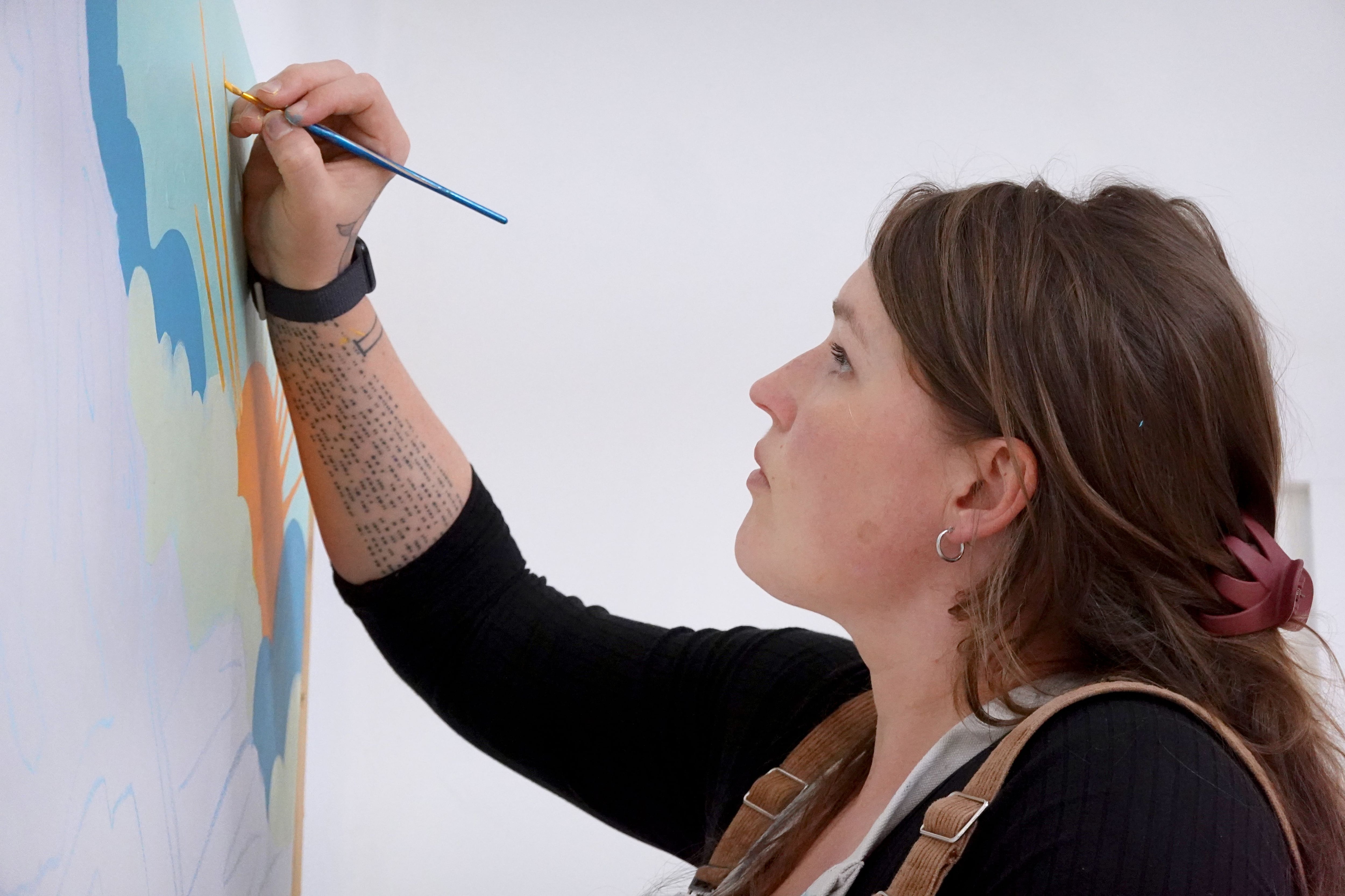 Eugene muralist Liza Mana Burns paints Oregon's stories to make