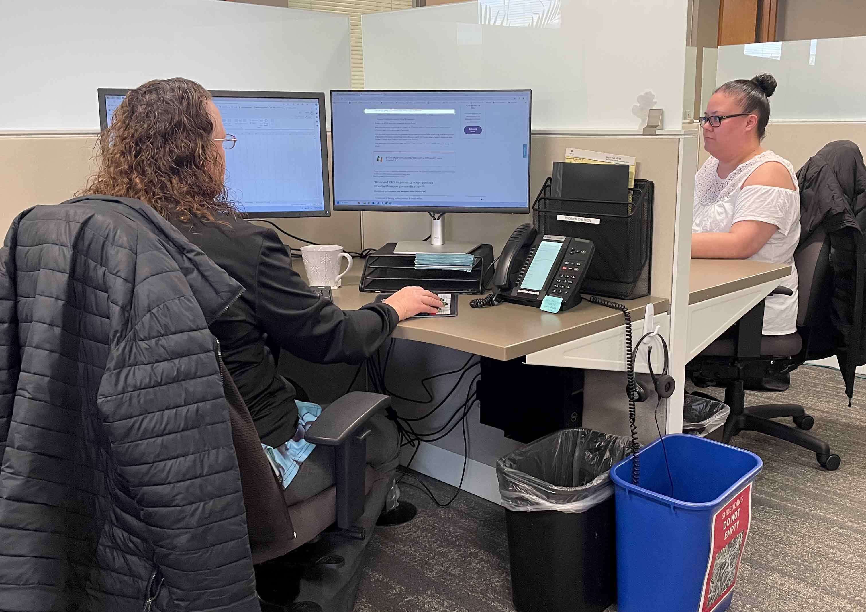 Members of the financial counseling team at Oregon Specialty Group. The massive disruption in claims processing has made it harder for them to help patients get qualified for copay assistance.