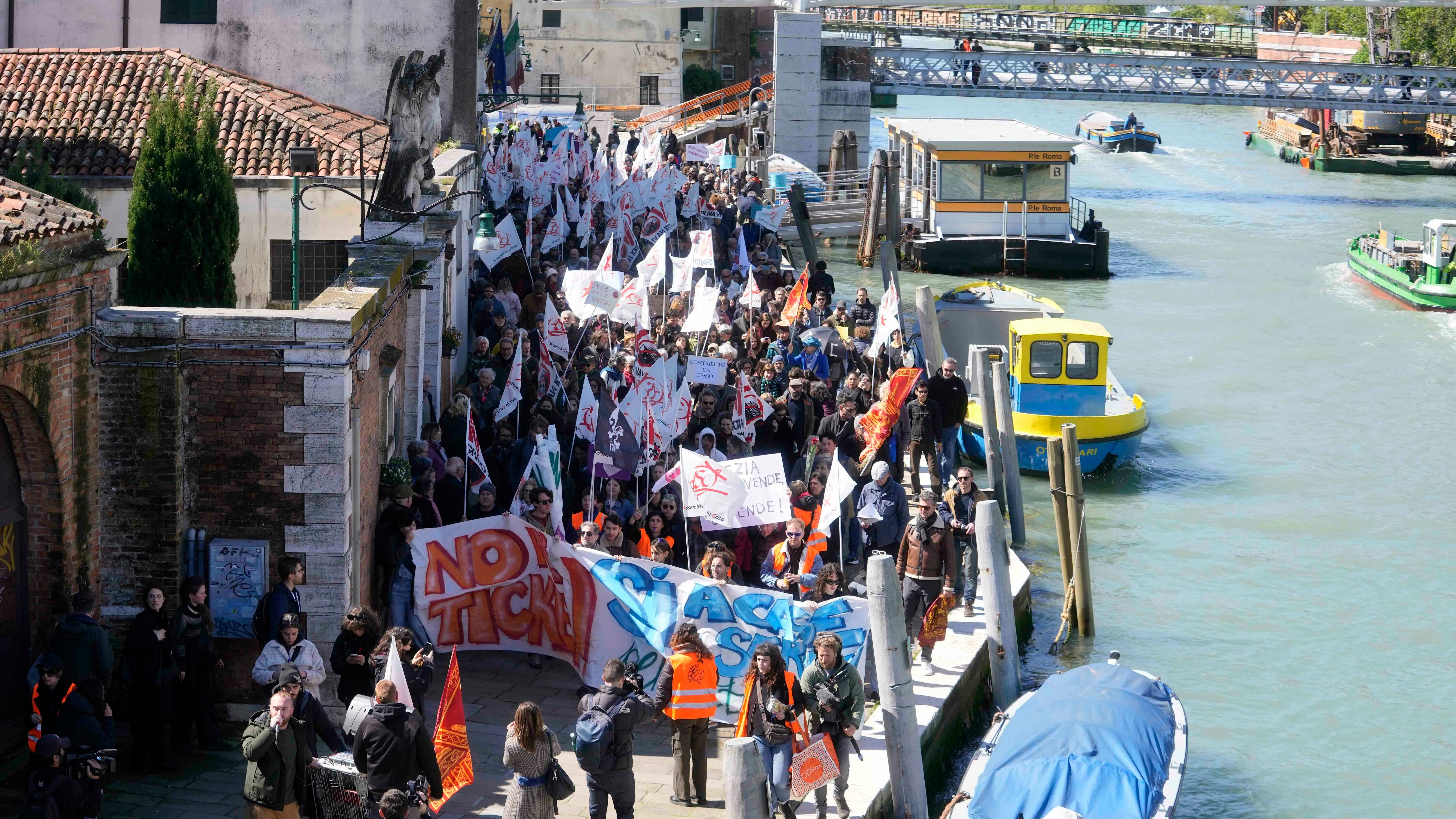 Citizens and activists stage a protest against Venice Tax Fee in Venice on Thursday.