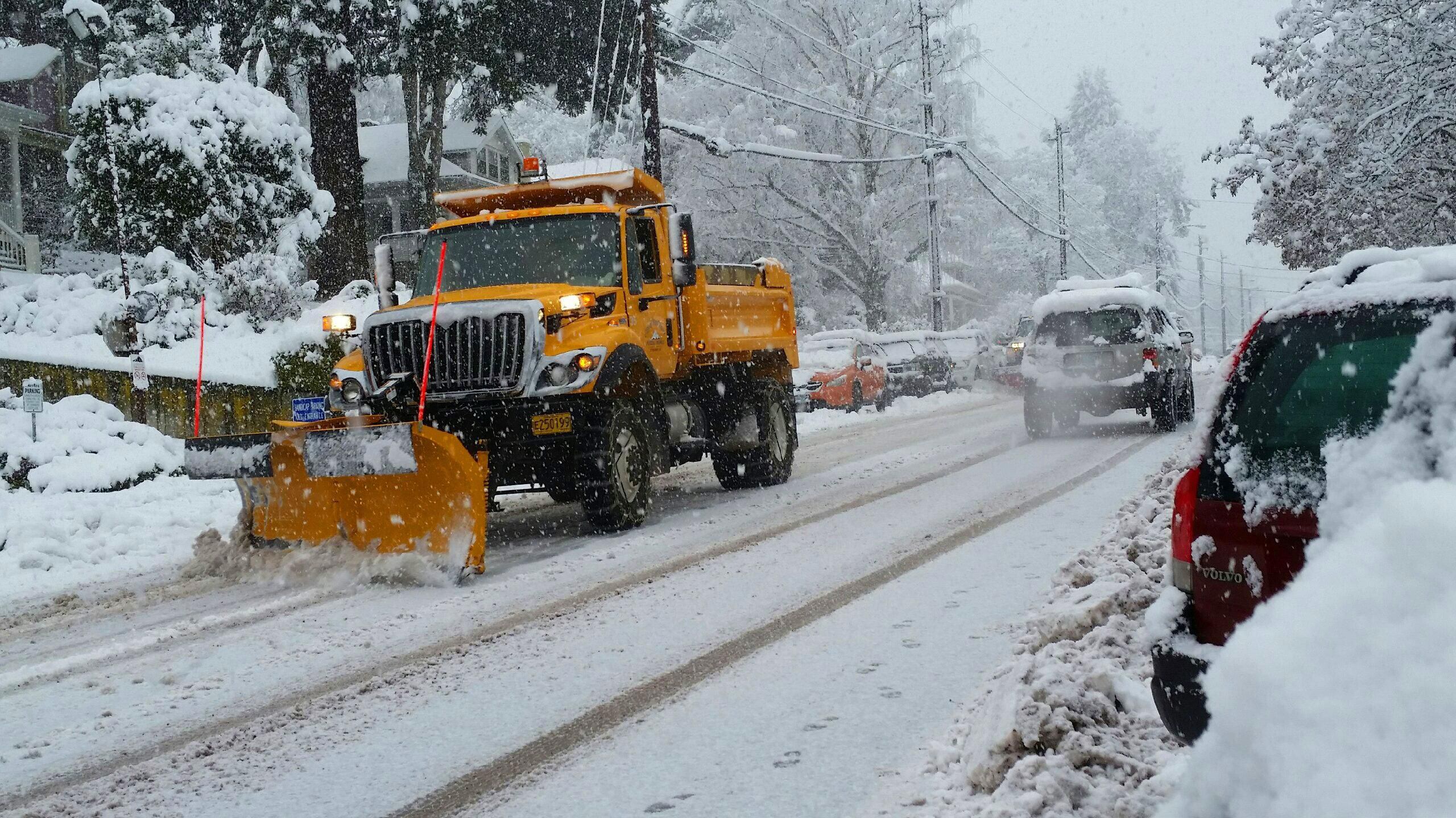A snow plow works on clearing State Street in downtown Hood River, Ore., last December. The Oregon Department of Transportation is hiring to fill 167 vacant positions, of which 146 are snow plow drivers.