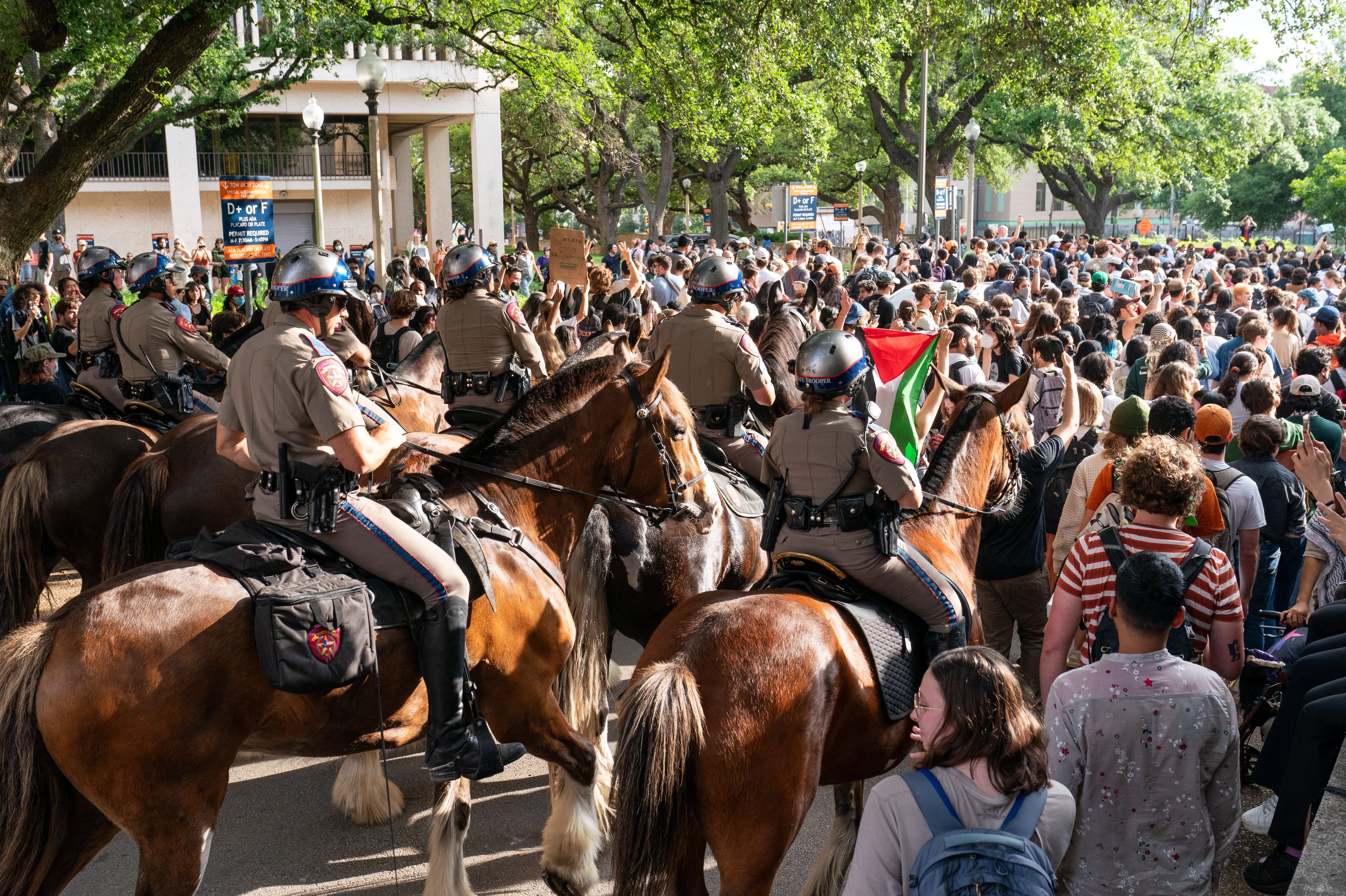 Texas State Troopers on horseback work to disperse pro-Palestinian students protesting the Israel-Hamas war on the campus of the University of Texas in Austin on Wednesday.