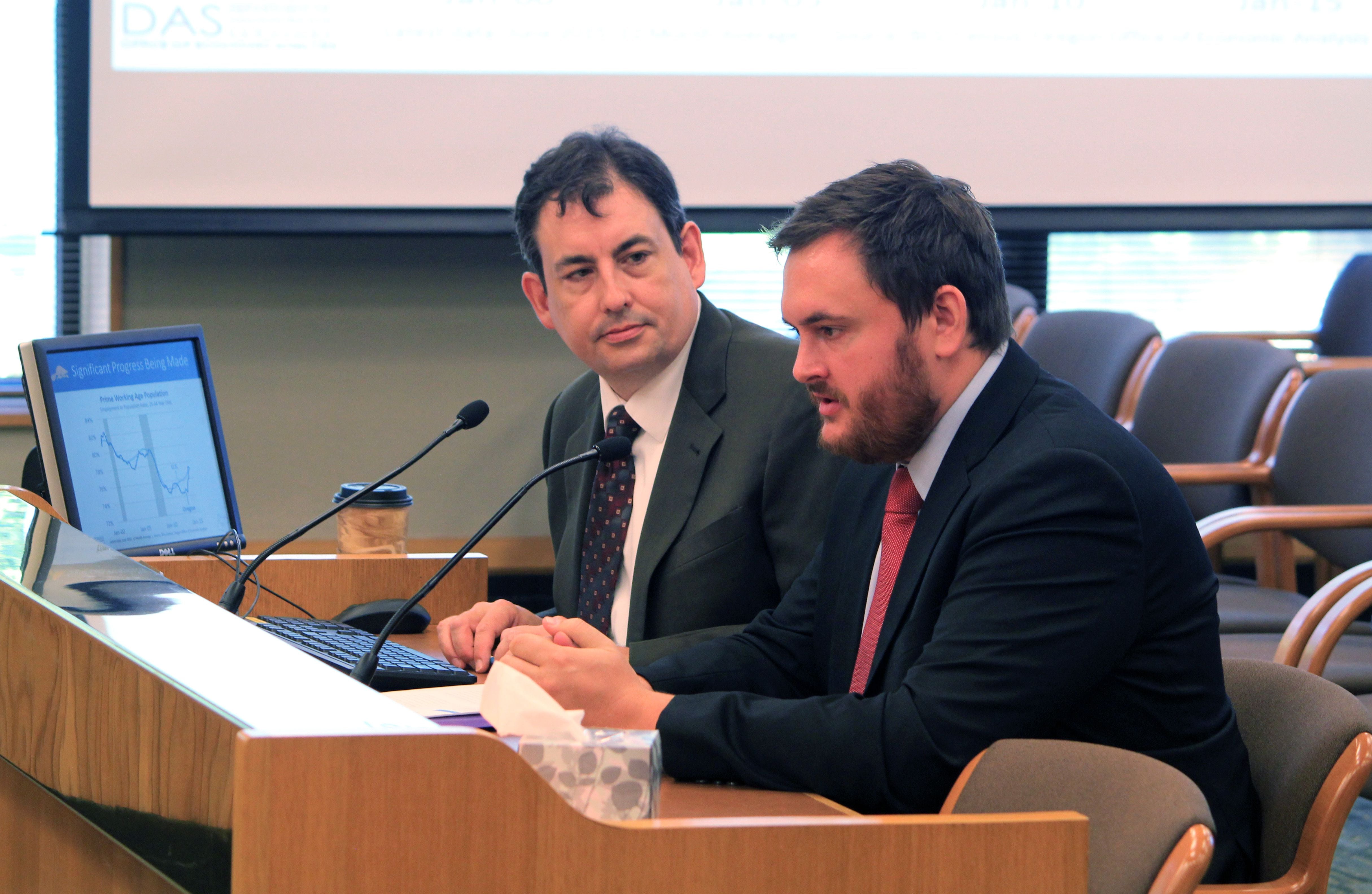FILE - State economists Mark McMullen, left, and John Lehner answer questions from Oregon lawmakers at the state Capitol in 2015.