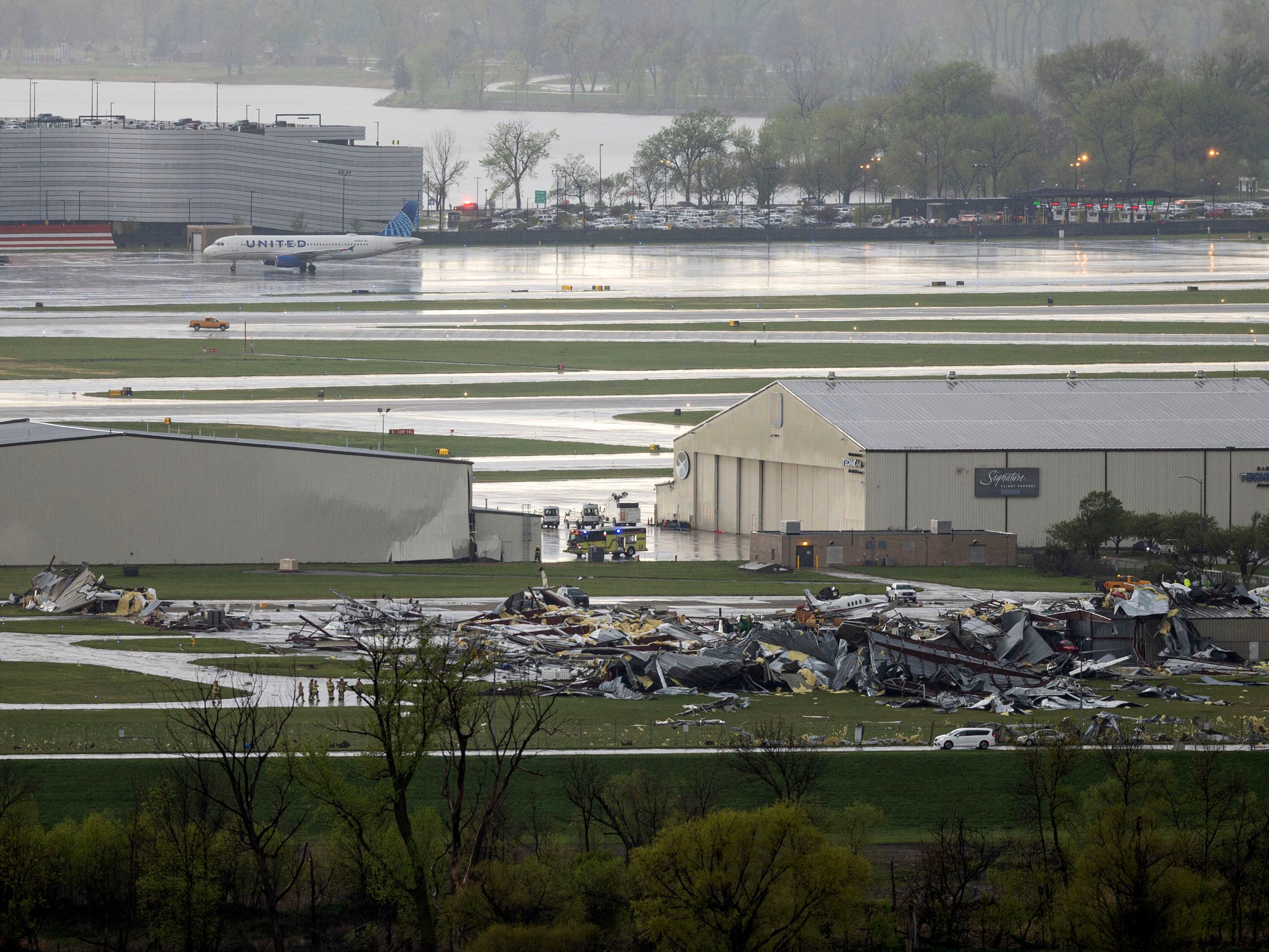 Severe weather damage to Eppley Airfield in Omaha, Neb., can be seen from the Lewis and Clark Monument in Council Bluffs, Iowa, Friday, April 26, 2024.