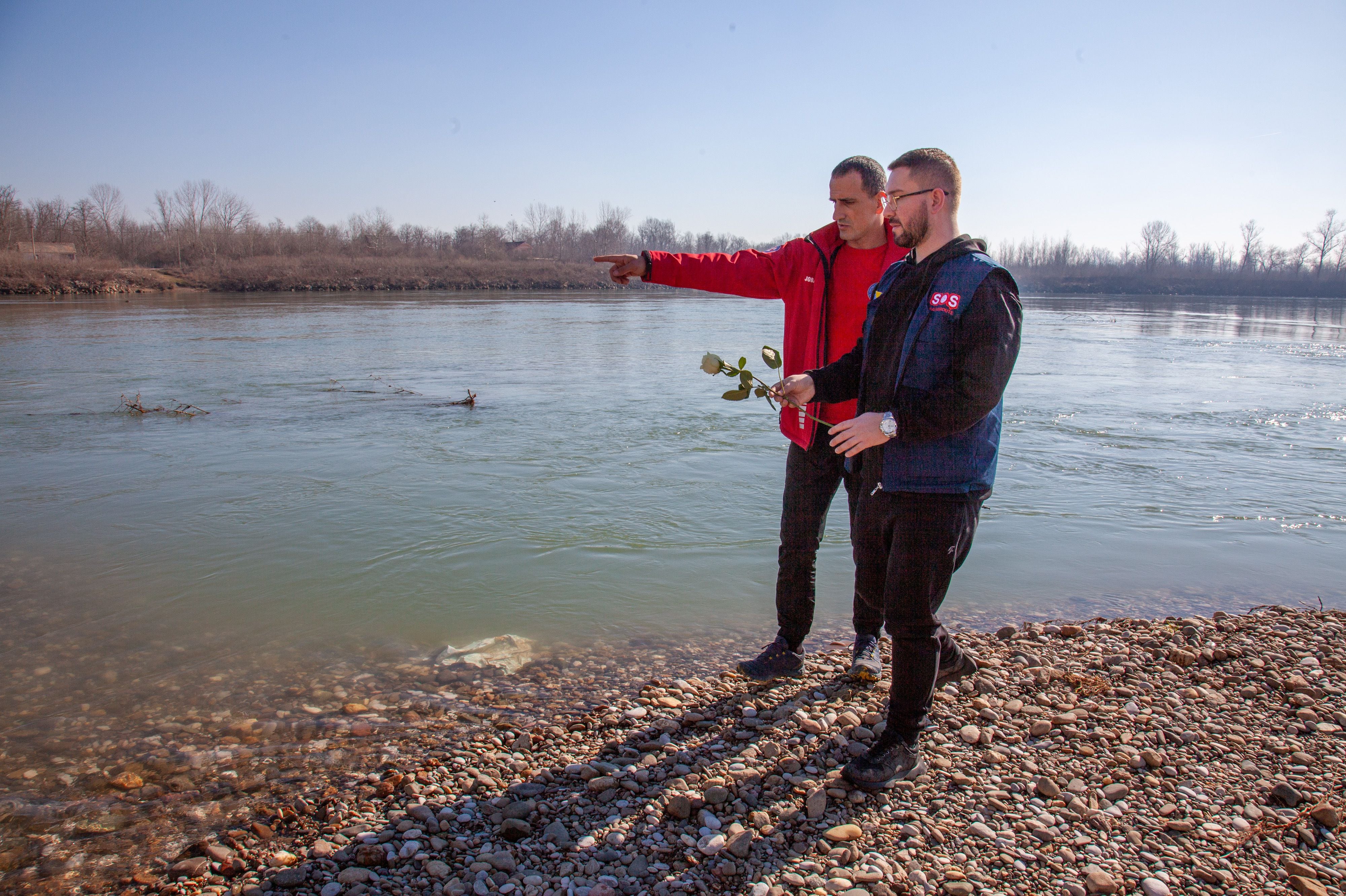 Nihad Suljić of Tuzla helps families of lost migrants; Nenad Jovanović is part of the Bosnian Mountain Search and Rescue operations, which recovers the bodies of those who drown in the Drina River. They're dropping four white roses in memory of those who perished. 